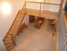 Fer rond sablé de 16 mm sur escalier en chêne